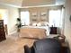 Bright main bedroom featuring tray ceiling, plush carpet, with a large window and elegant decor at 609 Redford Place Dr, Rolesville, NC 27571