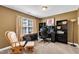 Office space with built-in desk, shelving, and natural light offers an ideal work-from-home environment at 609 Redford Place Dr, Rolesville, NC 27571