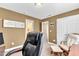 Office space features ample storage, a comfortable chair, and offers a functional work area at 609 Redford Place Dr, Rolesville, NC 27571