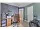 Home office space featuring a desk, shelving, and comfortable seating at 609 Redford Place Dr, Rolesville, NC 27571