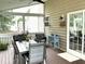 Back porch with table and chairs with string lights and backyard view at 609 Redford Place Dr, Rolesville, NC 27571
