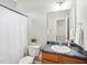 Bathroom featuring a toilet, shower with a curtain, and vanity in a neutral color scheme at 611 Ashbrittle Dr, Rolesville, NC 27571