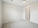 Bedroom featuring plush carpeting, a ceiling fan, and a door at 611 Ashbrittle Dr, Rolesville, NC 27571