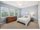 Comfortable bedroom with natural light, dresser, ceiling fan, and nice queen sized bed at 611 Ashbrittle Dr, Rolesville, NC 27571