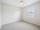 Bedroom featuring a window for natural light, carpet, and a ceiling fan at 611 Ashbrittle Dr, Rolesville, NC 27571