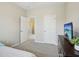Bedroom featuring carpet, neutral colored walls, and access to another bedroom at 611 Ashbrittle Dr, Rolesville, NC 27571