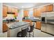 Well-equipped kitchen with stainless steel appliances, dark countertops, and plenty of cabinet space at 611 Ashbrittle Dr, Rolesville, NC 27571
