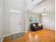 Bright living room with hardwood floors, a leather sofa, and plenty of natural light through the windows at 611 Ashbrittle Dr, Rolesville, NC 27571