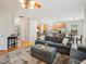 Open-concept living space connecting a living room and kitchen with modern furniture and hardwood floors at 611 Ashbrittle Dr, Rolesville, NC 27571