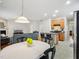 Light and airy open concept kitchen and living room with breakfast nook and comfortable gray sofa at 611 Ashbrittle Dr, Rolesville, NC 27571