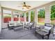 Well-lit sunroom with plenty of windows and wicker furniture at 611 Ashbrittle Dr, Rolesville, NC 27571
