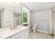 Well-lit bathroom with modern fixtures, a shower and a large window at 620 Martin Luther King Jr. Blvd # 302, Chapel Hill, NC 27514