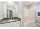 Bathroom featuring a single sink vanity, large mirror and combination tub and shower at 620 Martin Luther King Jr. Blvd # 302, Chapel Hill, NC 27514