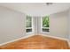 Bedroom featuring hardwood floors and a corner window with a beautiful view of the green landscape at 620 Martin Luther King Jr. Blvd # 302, Chapel Hill, NC 27514