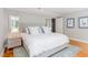 Relaxing bedroom showcases a plush bed, wood floors, and natural light at 620 Martin Luther King Jr. Blvd # 302, Chapel Hill, NC 27514