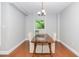 Dining room with hardwood floors, chandelier, and a view of the outdoors at 620 Martin Luther King Jr. Blvd # 302, Chapel Hill, NC 27514