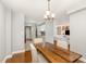 Dining room with wood floors and an open view to the living room and kitchen at 620 Martin Luther King Jr. Blvd # 302, Chapel Hill, NC 27514