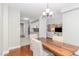 Dining area featuring hardwood floors and a view of the adjacent living room at 620 Martin Luther King Jr. Blvd # 302, Chapel Hill, NC 27514