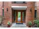 Exterior entryway showing double doors with side lites and potted greenery enhancing the entrance at 620 Martin Luther King Jr. Blvd # 302, Chapel Hill, NC 27514