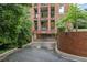 Apartment building with covered parking garage and lush green trees surrounding at 620 Martin Luther King Jr. Blvd # 302, Chapel Hill, NC 27514