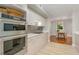 Modern kitchen featuring stainless steel appliances, white cabinetry, and tile backsplash at 620 Martin Luther King Jr. Blvd # 302, Chapel Hill, NC 27514