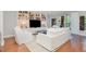 Bright living room boasts custom built-ins, modern furnishings, and a walkout balcony at 620 Martin Luther King Jr. Blvd # 302, Chapel Hill, NC 27514