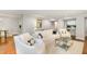 Open living room featuring hardwood floors, bright white furniture, and modern decor at 620 Martin Luther King Jr. Blvd # 302, Chapel Hill, NC 27514