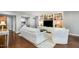 Well-lit living room with a large television, built-in shelves, and hardwood floors at 620 Martin Luther King Jr. Blvd # 302, Chapel Hill, NC 27514