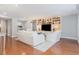 Spacious living room featuring beautiful hardwood floors and custom built-in shelving at 620 Martin Luther King Jr. Blvd # 302, Chapel Hill, NC 27514