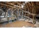 Unfinished attic space with exposed beams, ductwork, and a wooden floor at 623 Cabin Crk, Pittsboro, NC 27312