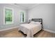Neutral bedroom with natural light and wood-look flooring at 623 Cabin Crk, Pittsboro, NC 27312