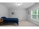 Cozy bedroom with natural light and a comfortable blue quilted bedspread at 623 Cabin Crk, Pittsboro, NC 27312