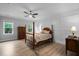 Cozy bedroom with hardwood floors, natural light, and ample closet space at 623 Cabin Crk, Pittsboro, NC 27312