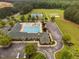 Complete aerial view of the community pool, tennis court, sport court, and athletic field at 623 Cabin Crk, Pittsboro, NC 27312