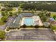 Aerial view of the community pool and amenity center with a playground at 623 Cabin Crk, Pittsboro, NC 27312