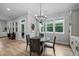Bright dining area with wood flooring and a pendant light fixture at 623 Cabin Crk, Pittsboro, NC 27312