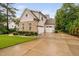 Charming two-story brick home with manicured lawn and a three car garage at 623 Cabin Crk, Pittsboro, NC 27312
