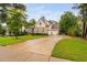 Charming two-story brick home with manicured lawn and a three car garage at 623 Cabin Crk, Pittsboro, NC 27312