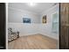 Bright, airy flex room with wainscoting detail and wood-look flooring at 623 Cabin Crk, Pittsboro, NC 27312