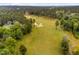 Expansive golf course view with manicured greens and sand traps surrounded by mature trees at 623 Cabin Crk, Pittsboro, NC 27312
