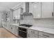 Stylish kitchen with quartz countertops, sleek appliances, and a modern backsplash, perfect for culinary enthusiasts at 623 Cabin Crk, Pittsboro, NC 27312