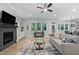 Bright living room featuring a fireplace with tile surround at 623 Cabin Crk, Pittsboro, NC 27312