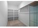 Organized walk-in closet with built-in shelving and ample storage space at 623 Cabin Crk, Pittsboro, NC 27312