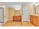 Bathroom with a sink, neutral paint, two mirrors, and lots of cabinets at 6423 New Market Way, Raleigh, NC 27615