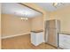 Bright dining area featuring stainless steel refrigerator, wood floors, and eat-in kitchen island with granite countertops at 6423 New Market Way, Raleigh, NC 27615