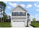 Beautiful home with gray siding, white garage doors, manicured lawn, and lovely curb appeal at 708 Blazer Bnd, Wendell, NC 27591