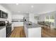 Open kitchen with stainless steel appliances, granite countertops and adjacent dining area at 708 Blazer Bnd, Wendell, NC 27591