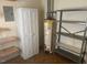 Unfinished storage room with a water heater and shelves at 708 Old Barn Ave, Durham, NC 27704