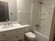 Bathroom featuring a vanity and tub with tile surround at 708 Old Barn Ave, Durham, NC 27704
