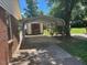 View of the side yard with covered parking and a storage shed at 708 Old Barn Ave, Durham, NC 27704